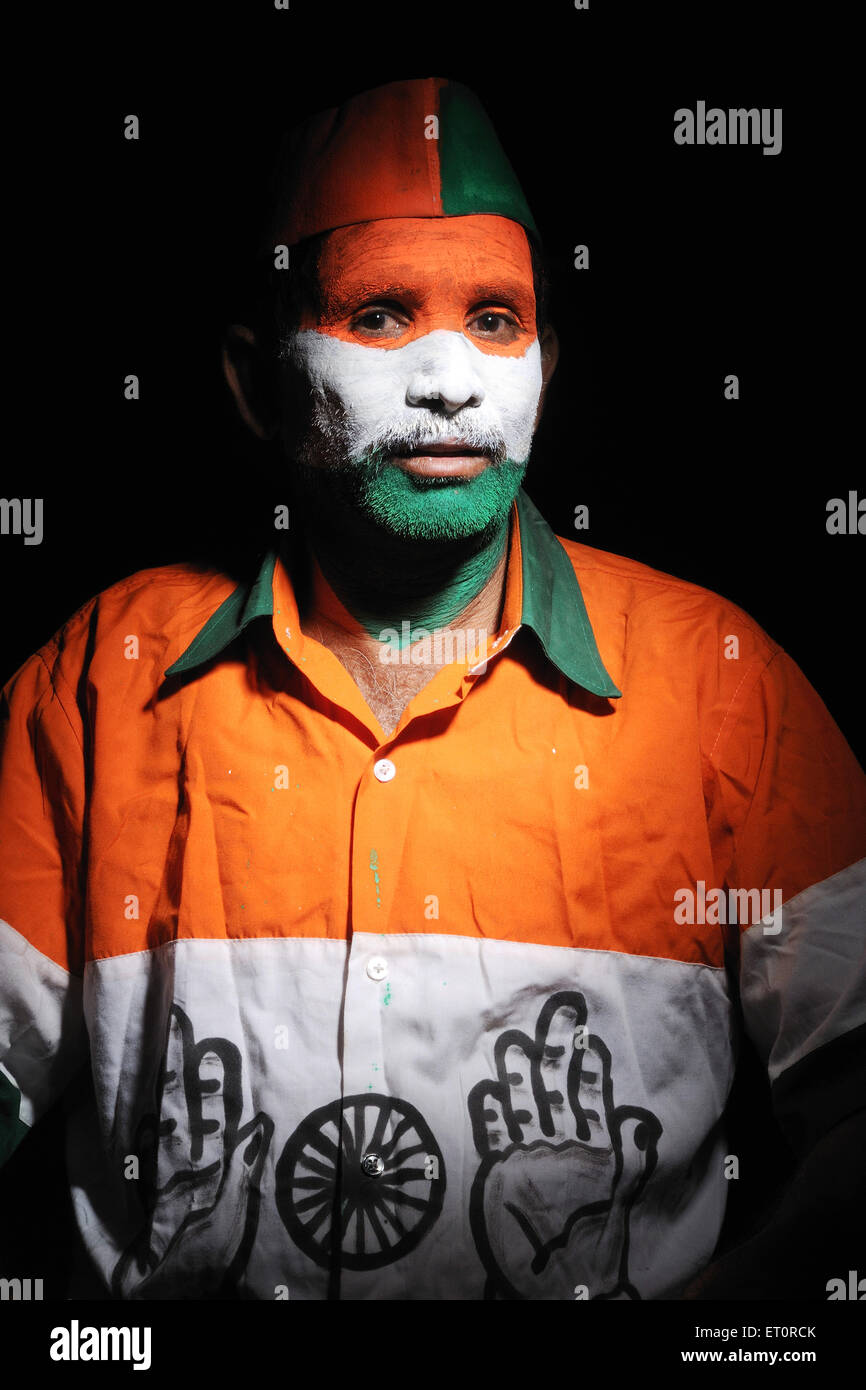 Indian flag of India painted on face and Congress party flag India MR#769B Stock Photo