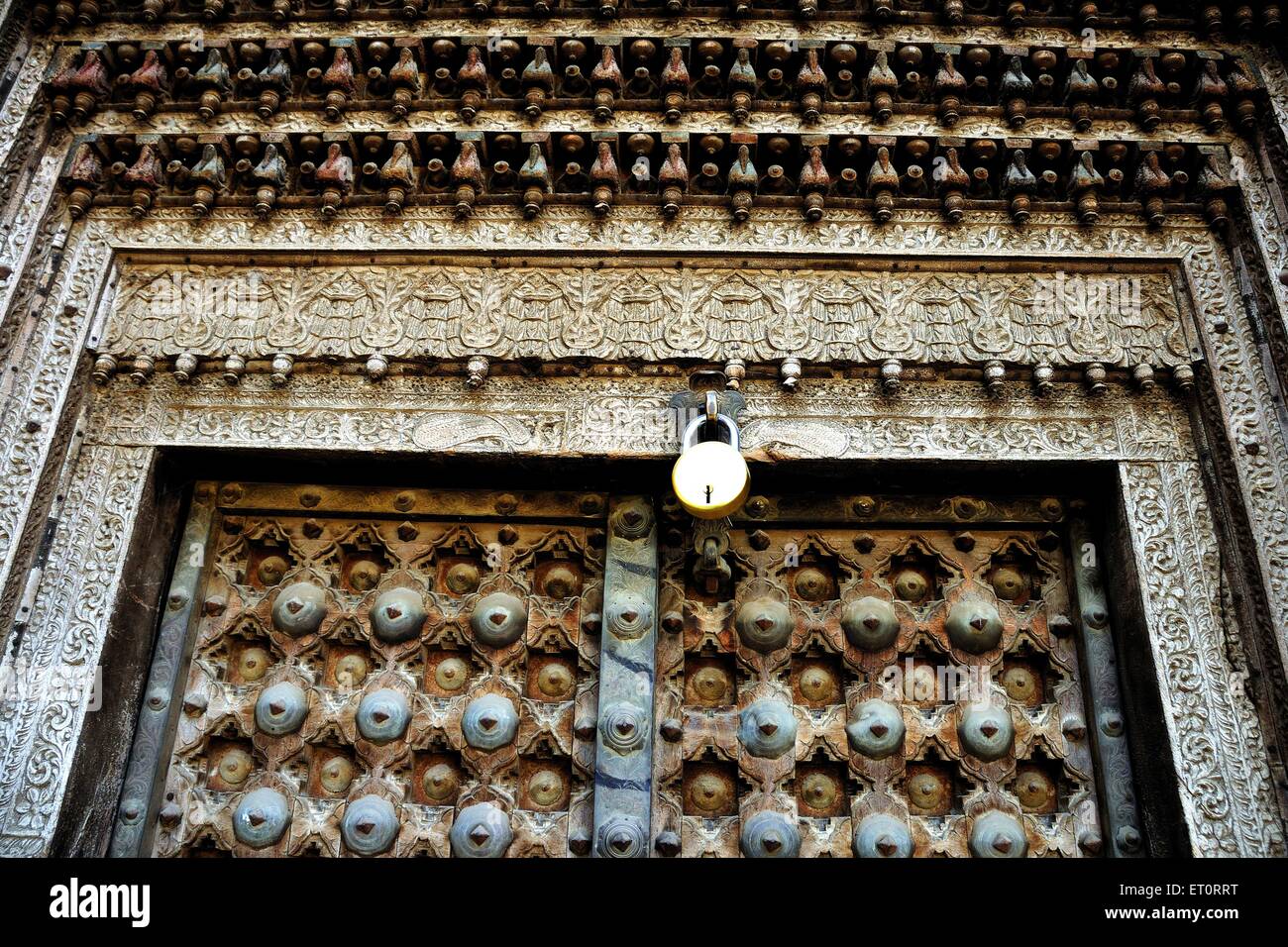 Wooden carving on door of haveli Fatehpur Shekhawati Rajasthan India Stock Photo