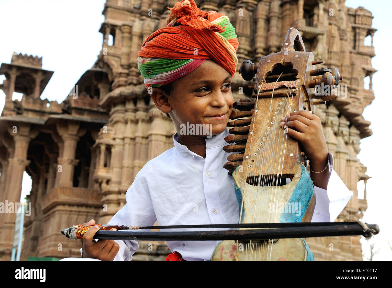 Boy playing sarangi ; Deval ; Mandore ; Jodhpur ; Rajasthan ; India MR ...