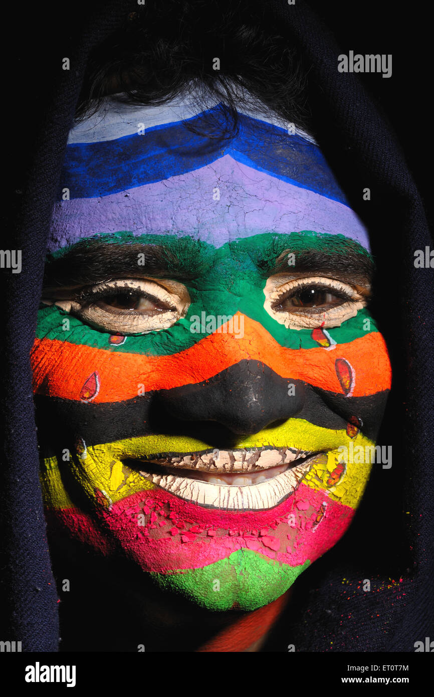 Painted face of man showing sad mood but smiling MR#769G Stock Photo