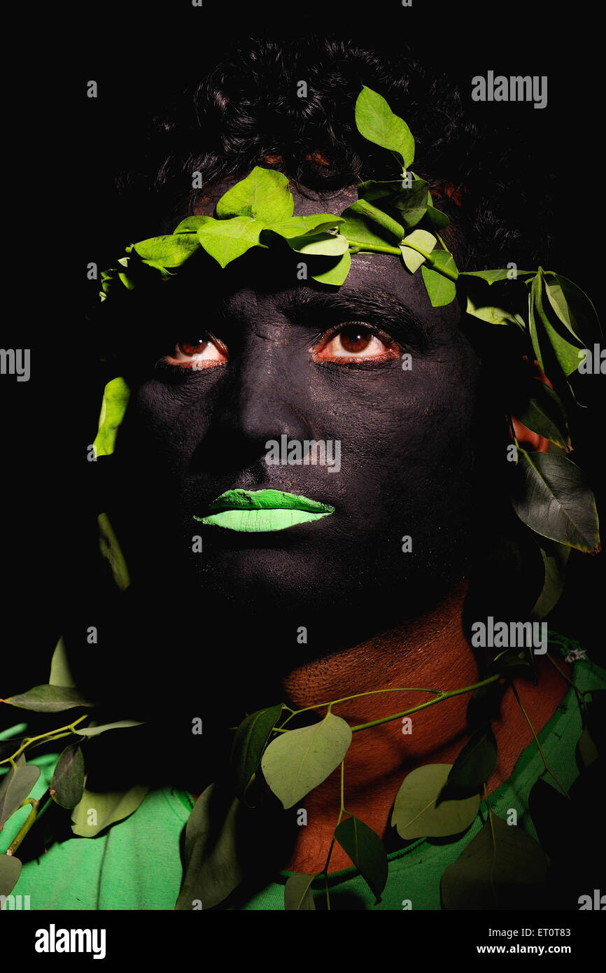 man camouflage disguise hide conceal tribal painted face MR#769G Stock Photo