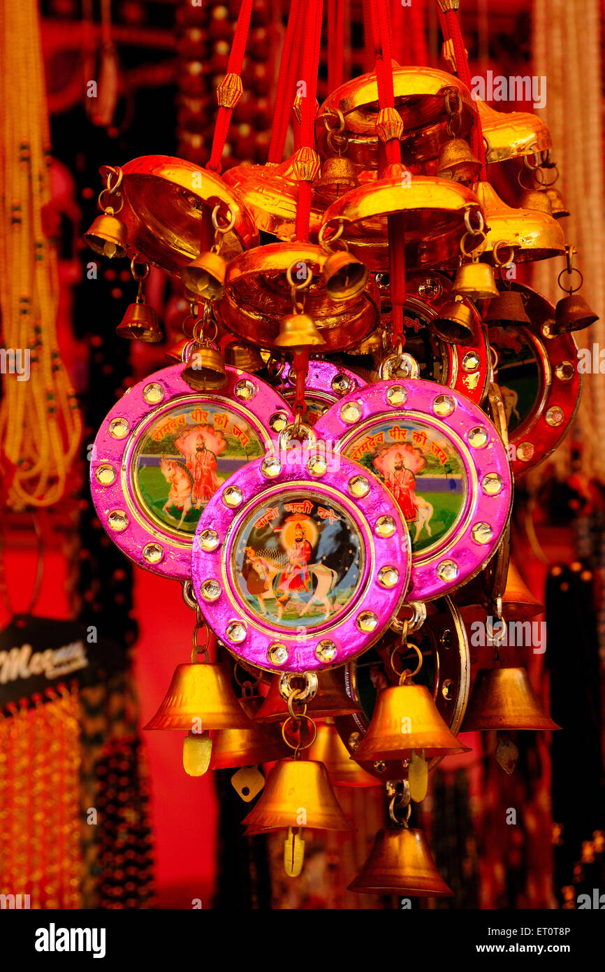 Ramdev baba photo on bells ; Ramdevra ; Jaisalmer ; Rajasthan ; India Stock Photo