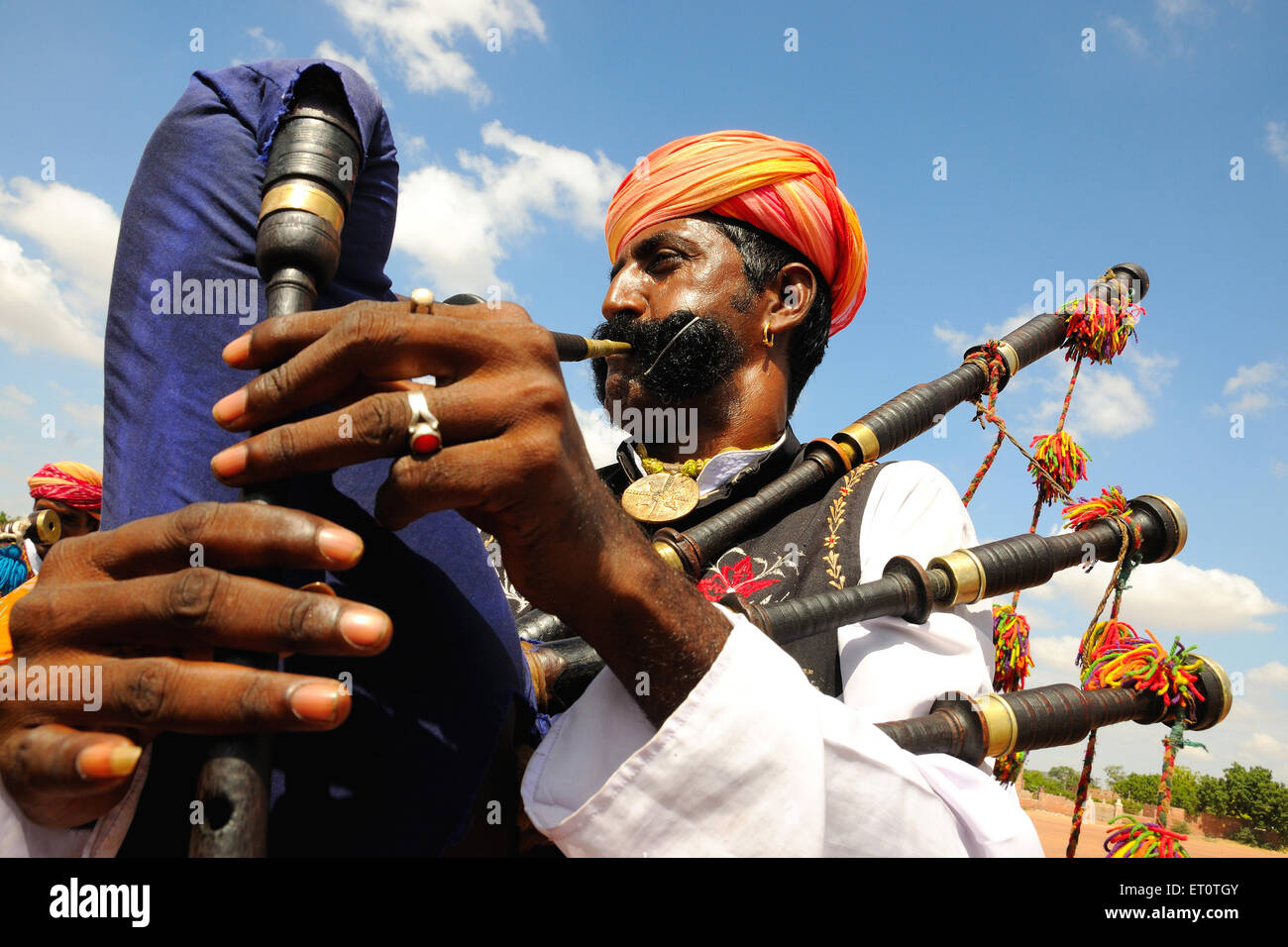 Indian man playing bagpipe, Rajasthan, India Stock Photo