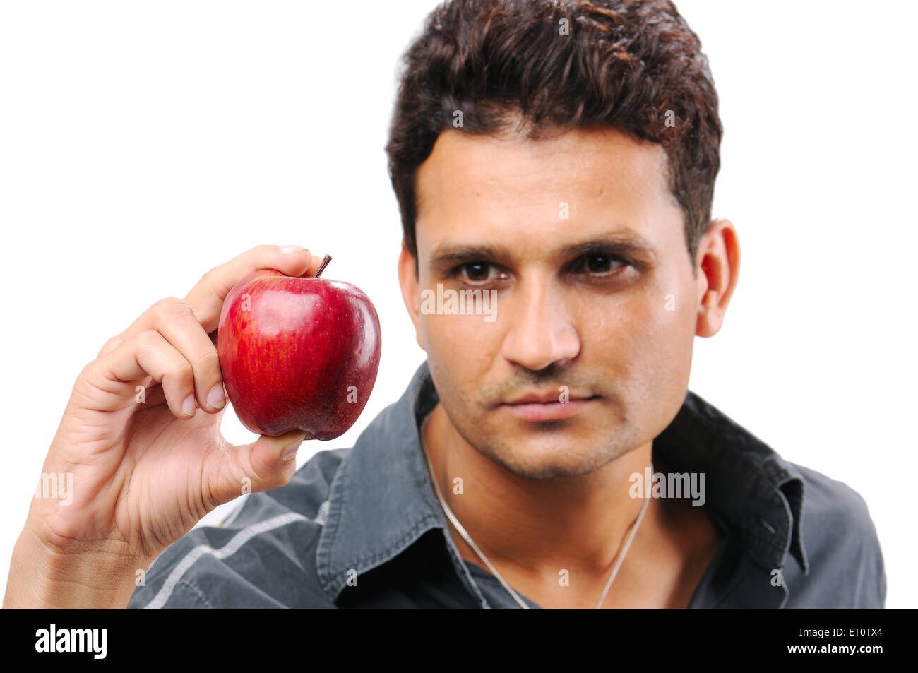Man holding apple on white background MR#786 Stock Photo