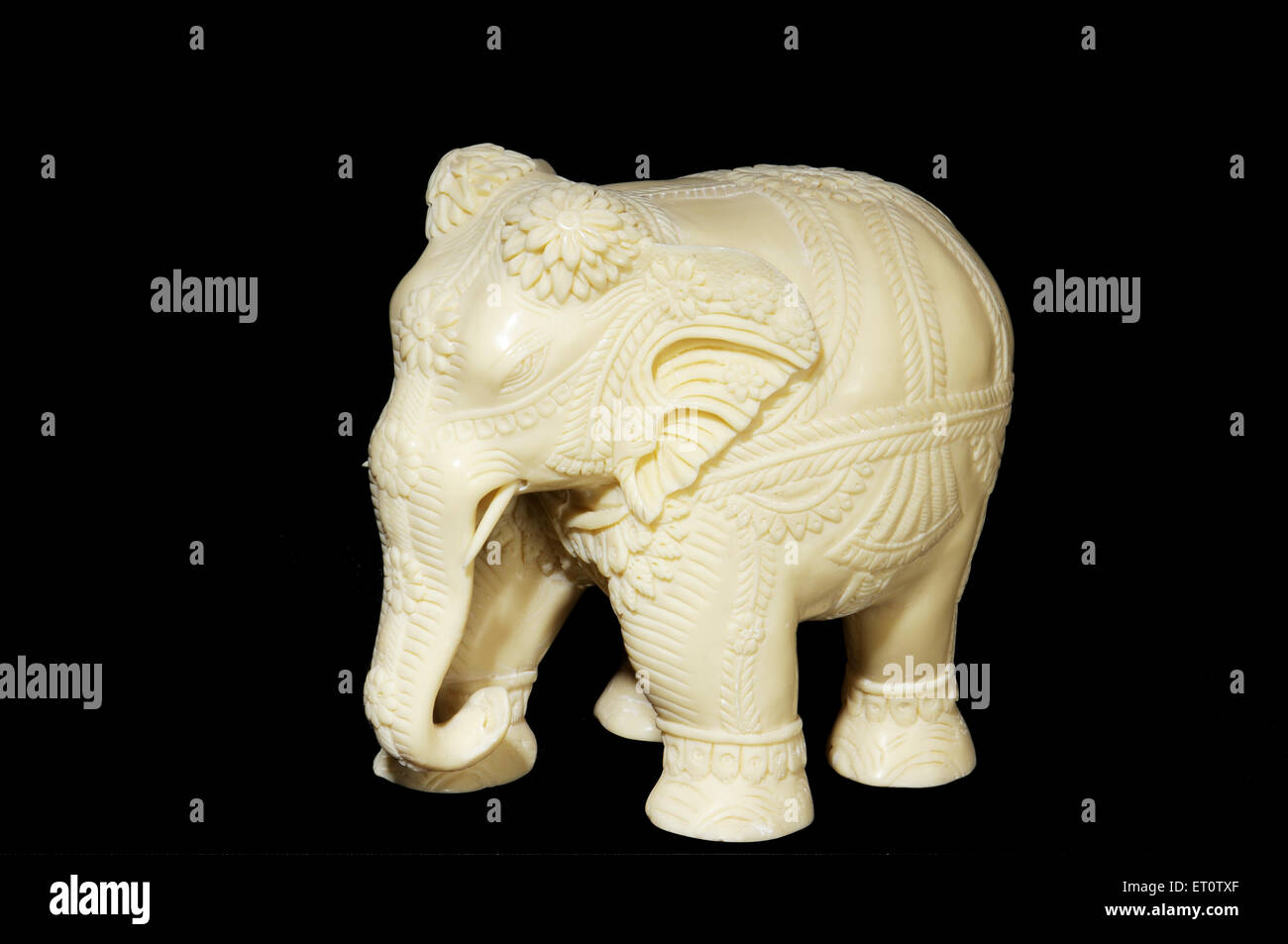 Elephant handicraft from elephants tusk on black background Stock Photo