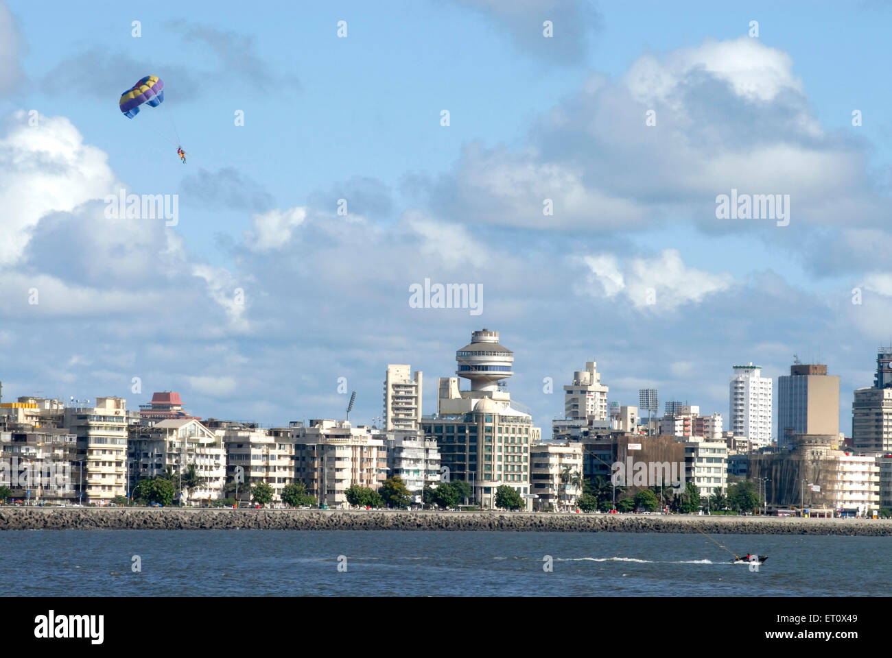 Parasailing ; paragliding by power boats ; Nariman Point ; Marine Drive ; Charni Road ; coast of Arabian sea ; Bombay Mumbai Stock Photo