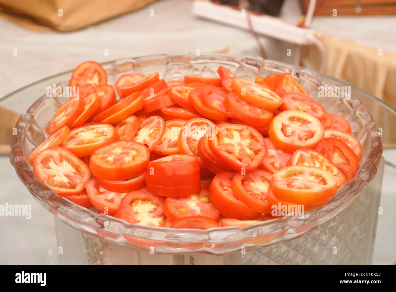 Tomato slices for buffet lunch arrangement for marriage ceremony party, Bombay, Mumbai, Maharashtra, India Stock Photo