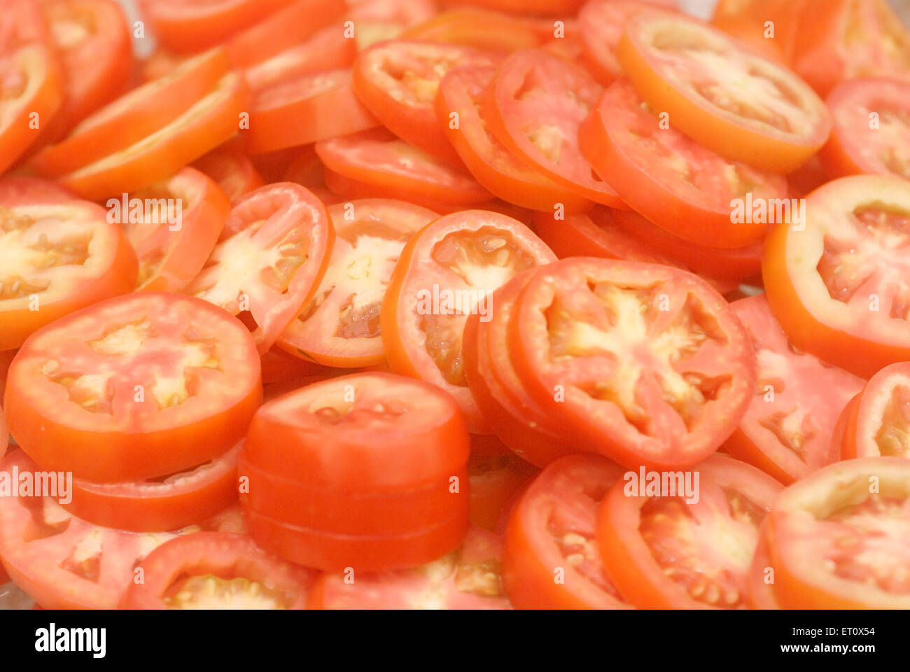 Tomato slices for buffet lunch arrangement for marriage ceremony party, Bombay, Mumbai, Maharashtra, India Stock Photo