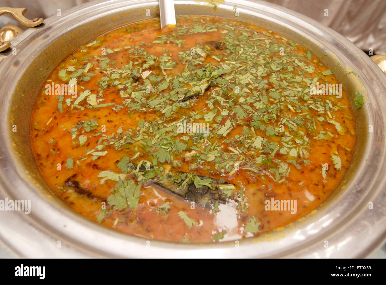 Dal fry ; spicy curry of split grams ; Buffet lunch arrangement for marriage ceremony party ; Indian food ; Mumbai ; Maharashtra Stock Photo