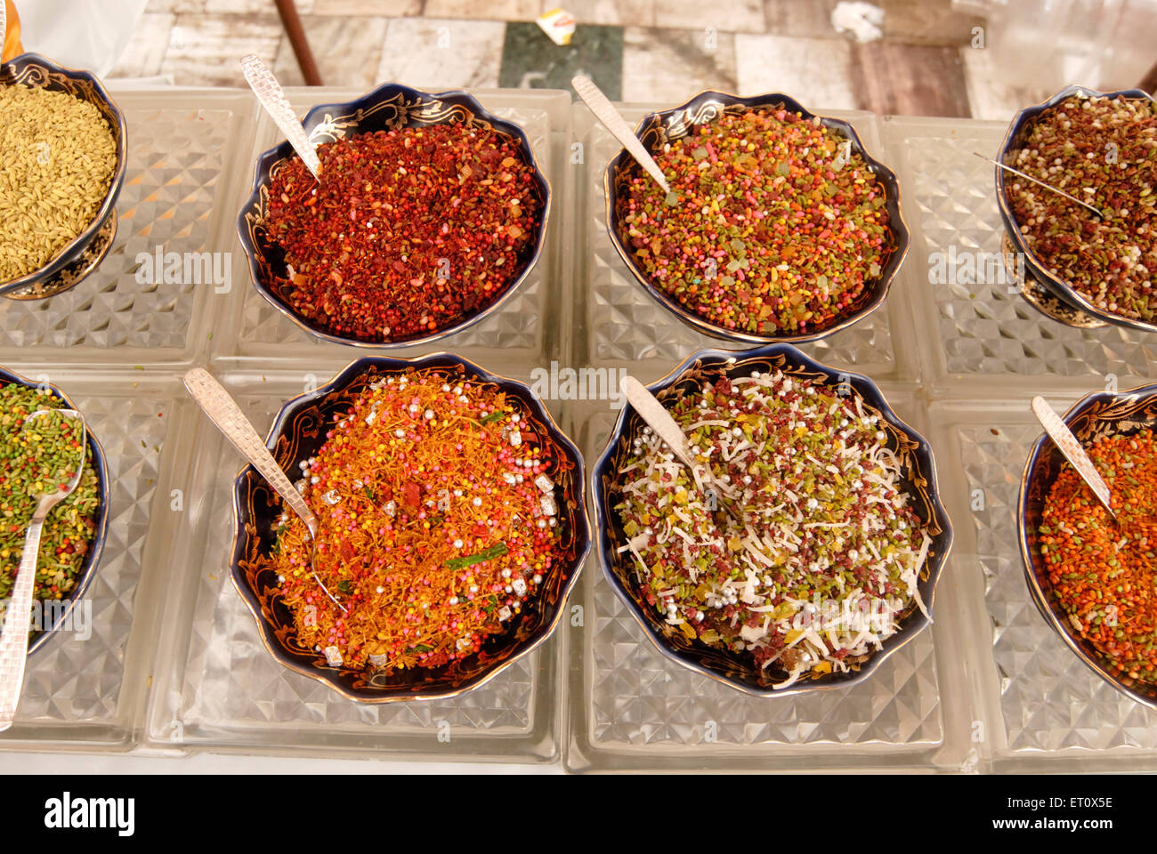Different types Mukhwas kept designer bowls ; eaten meal aid digestion and freshen mouth ; Indian wedding menu ; Mumbai Stock Photo