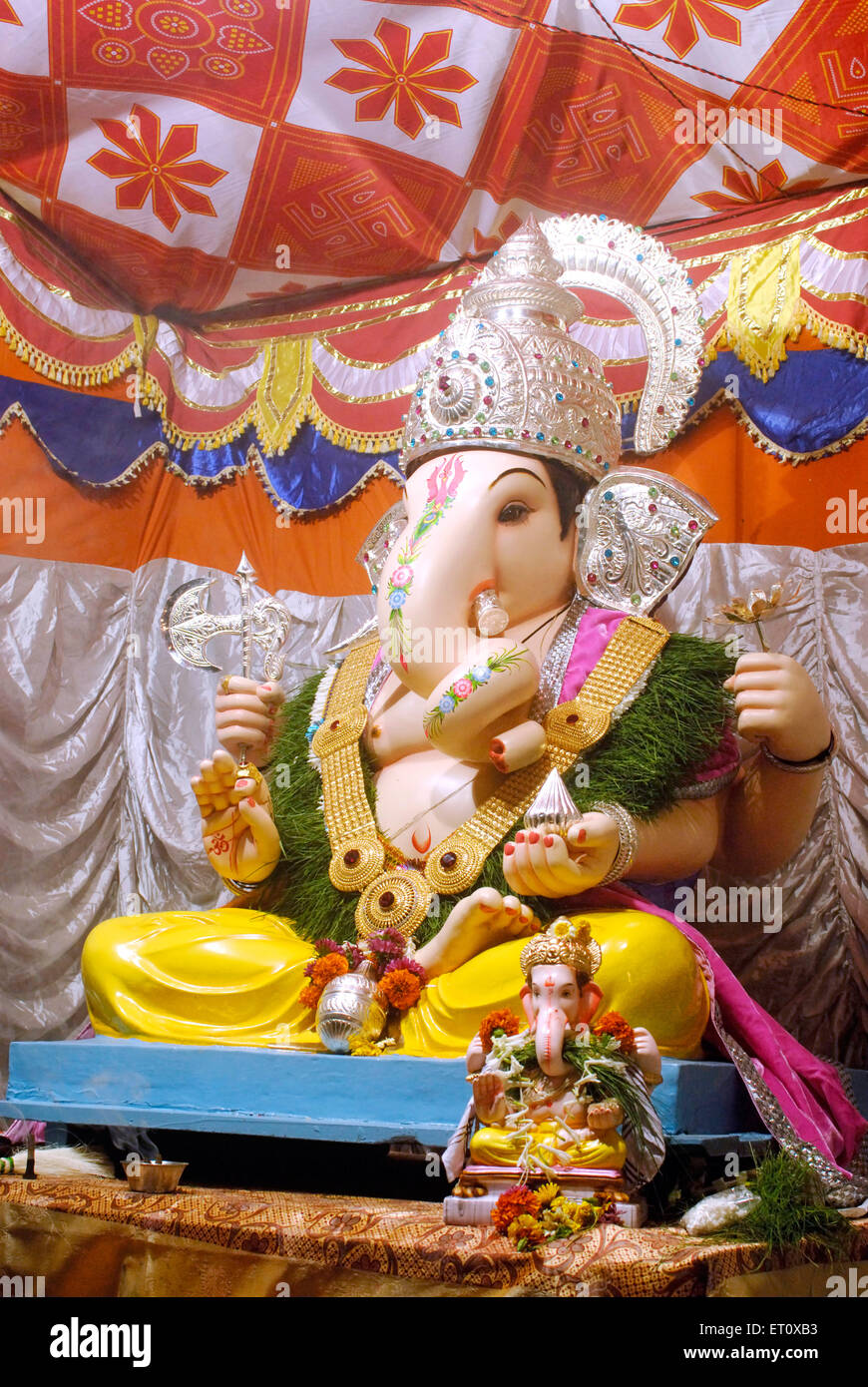 Richly decorated idol of lord Ganesh elephant headed god of Hindu worshiping for Ganapati festival at Pune Stock Photo