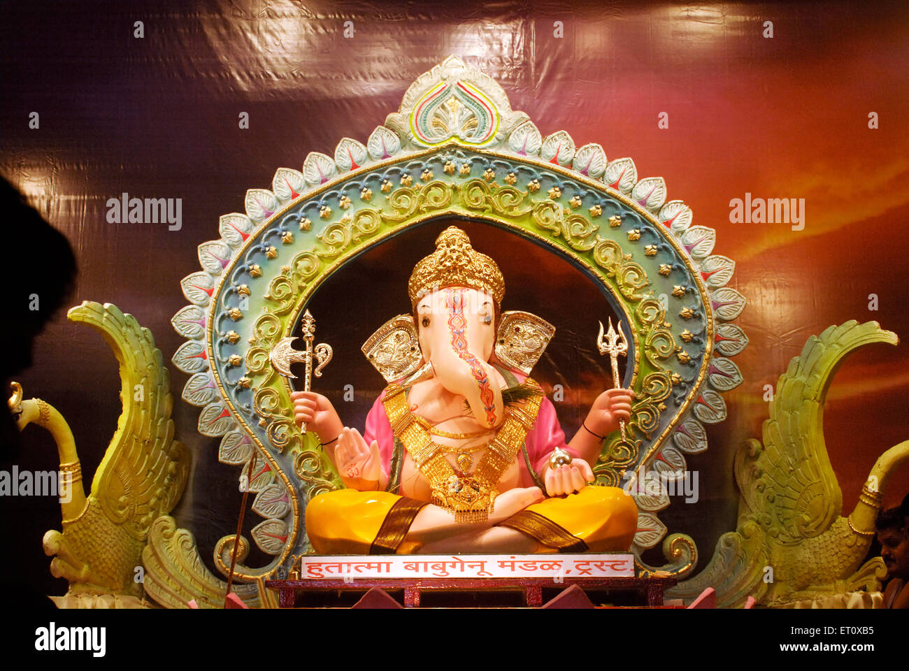 Richly decorated idol of Lord Ganesh elephant headed god ; Ganapati festival at Babu Genu Mandal ; Pune ; Maharashtra ; India Stock Photo
