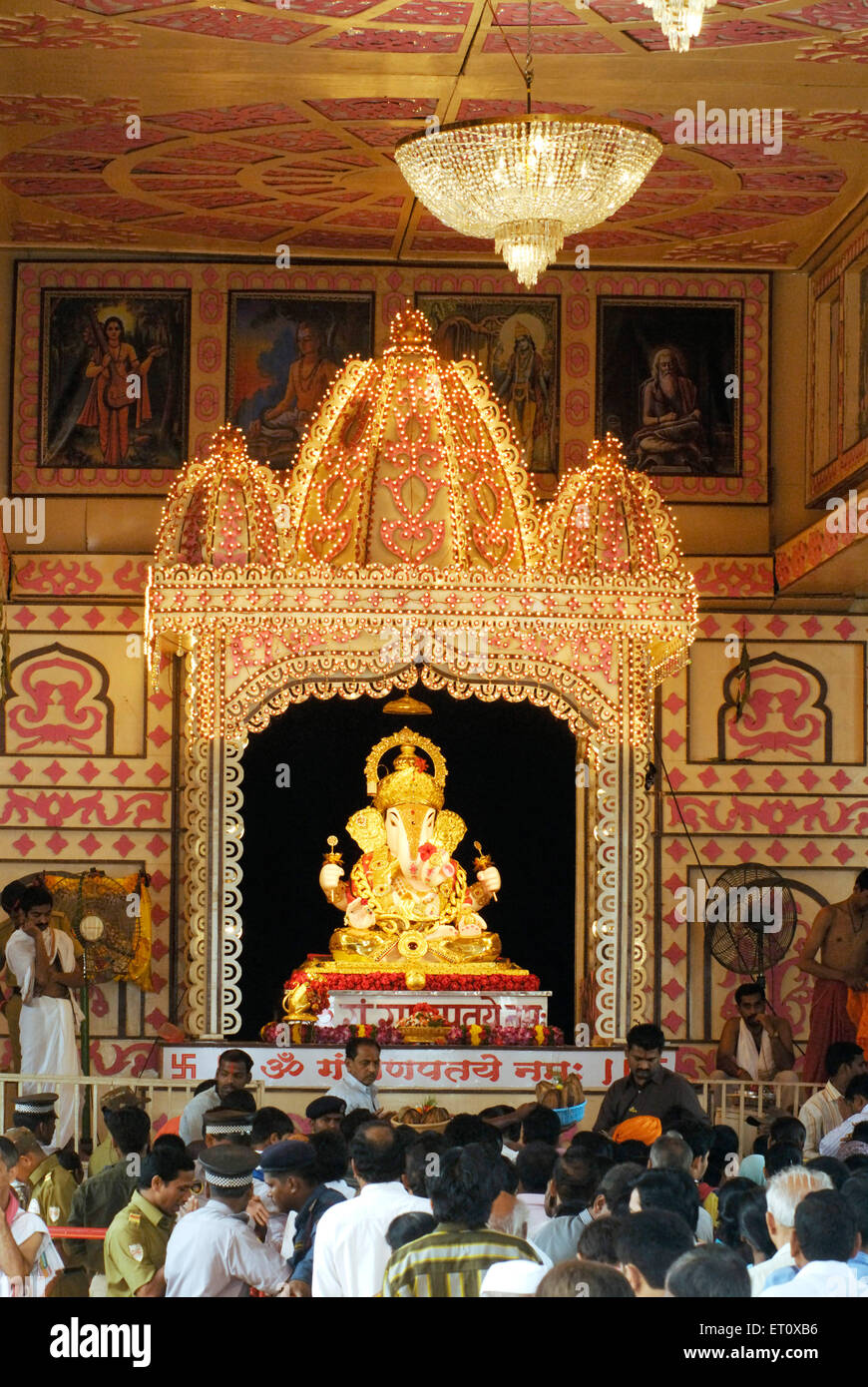 Idol of Lord Ganesh with richly illuminated decoration of Dagdu Seth Halwai Mandal Ganapati festival of 2008 at Pune Stock Photo