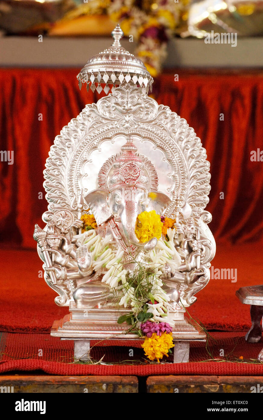 Silver metal idol of lord Ganesh with ten hands dashbhuja ; elephant headed God ; Ganapati festival year 2008 at Pune Stock Photo