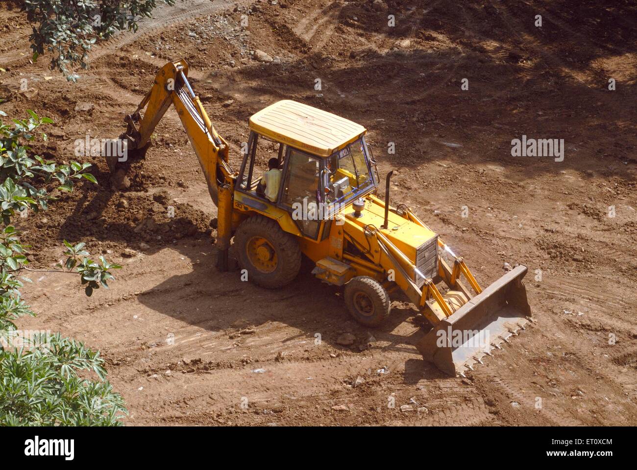Aerial view of excavator and digger at work known as backhoe loader heavy machinery ; Borivali ; Bombay Stock Photo