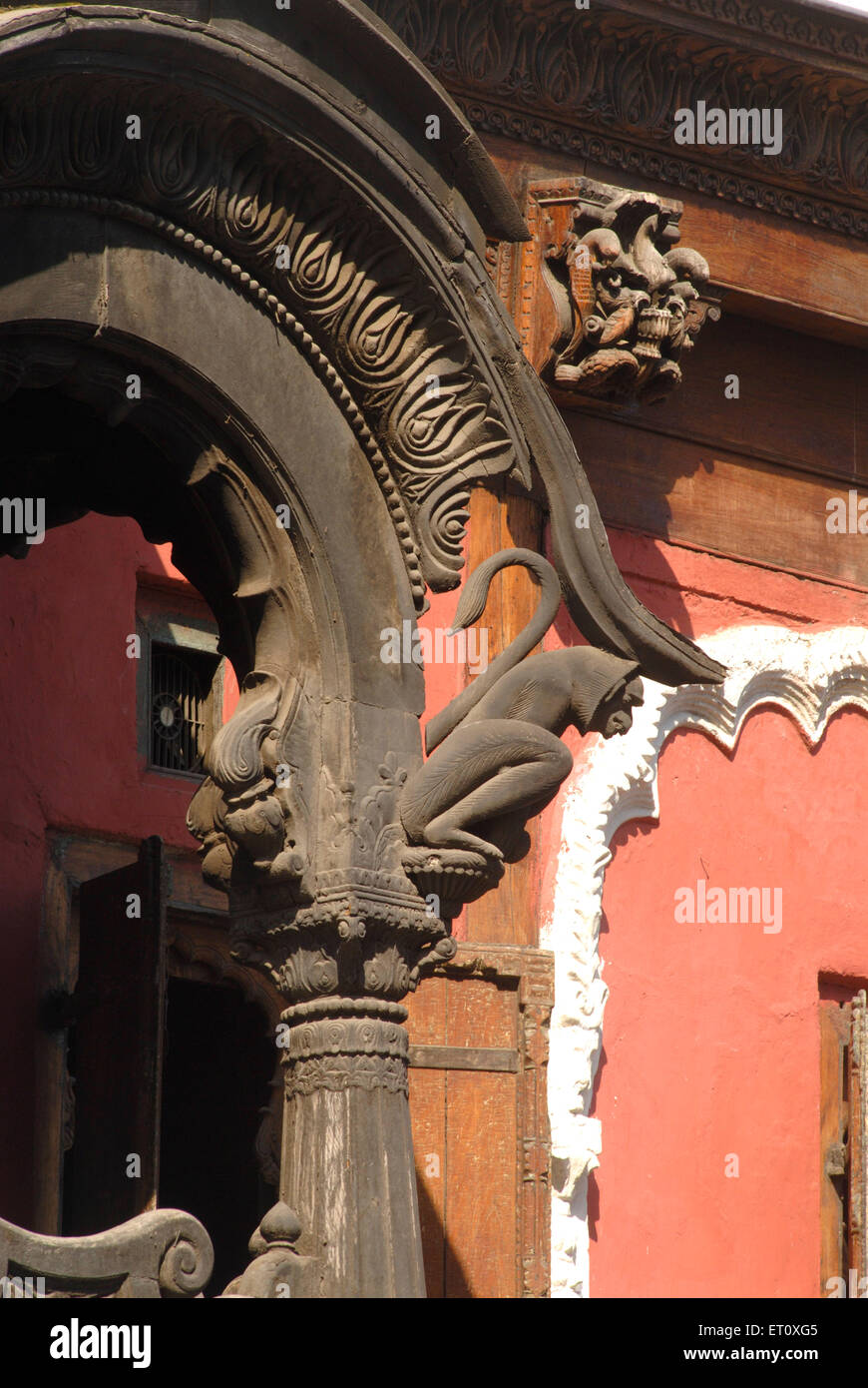 Wood carved pillar with monkey and floral design at entrance of Vishrambaug Wada second palace of Peshve the Maratha king ; Pune Stock Photo