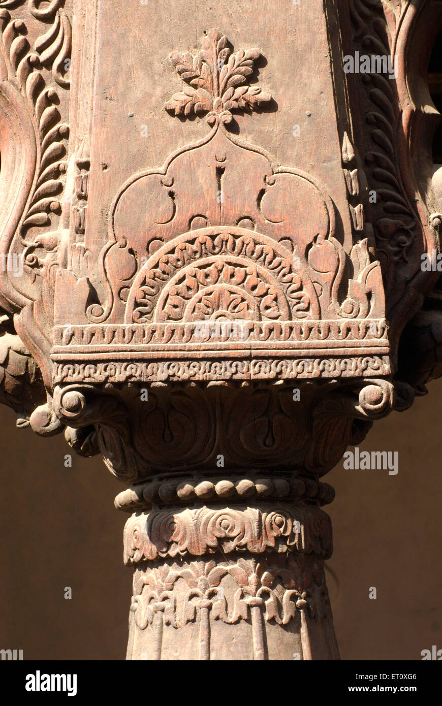Geometrical floral design carved wooden pillar at entrance of Vishrambaug Wada second palace of Peshve the Maratha king ; Pune Stock Photo
