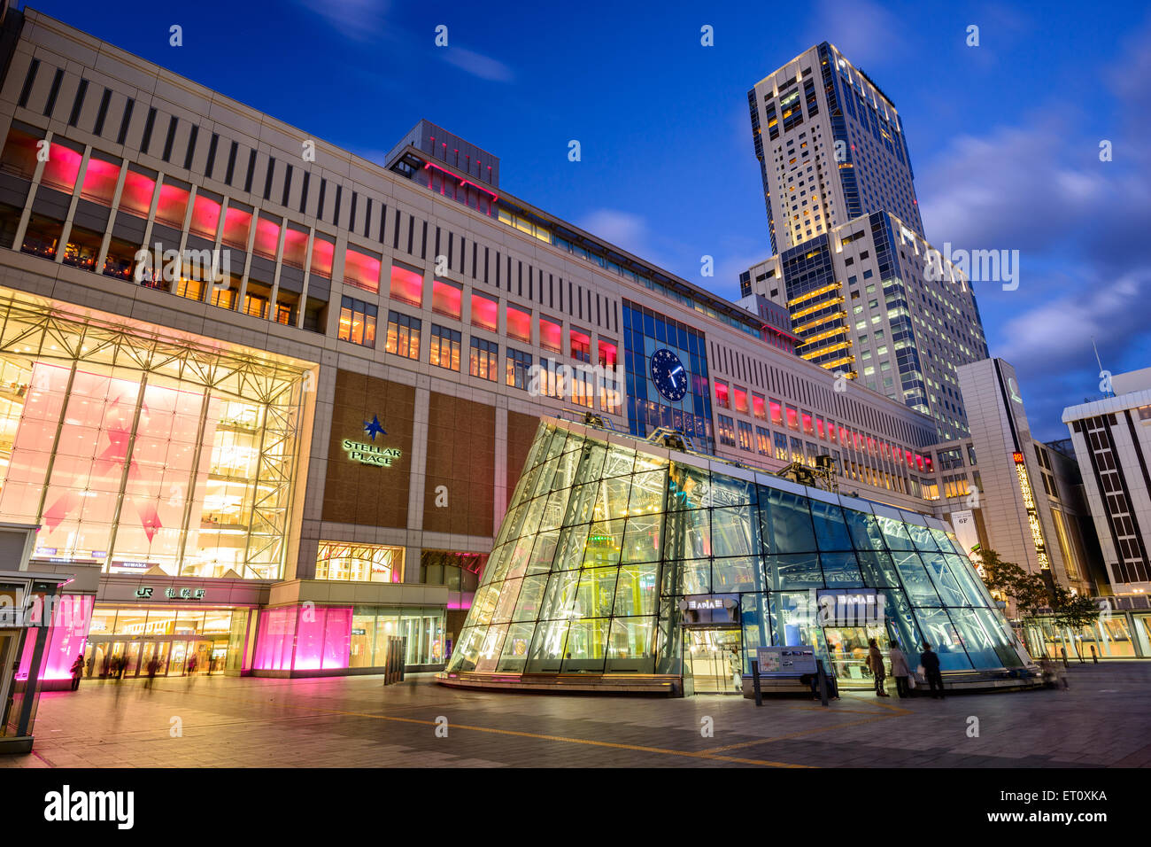 Sapporo Station exterior at twilight. The adjacent Japan Railway building is the tallest in the city. Stock Photo