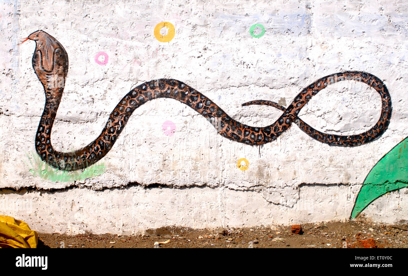 Indian Cobra Venomous Snake reptile Naja fasciata painted on wall of Rajiv Gandhi Zoological park Katraj Pune Maharashtra India - nmk 156772 Stock Photo