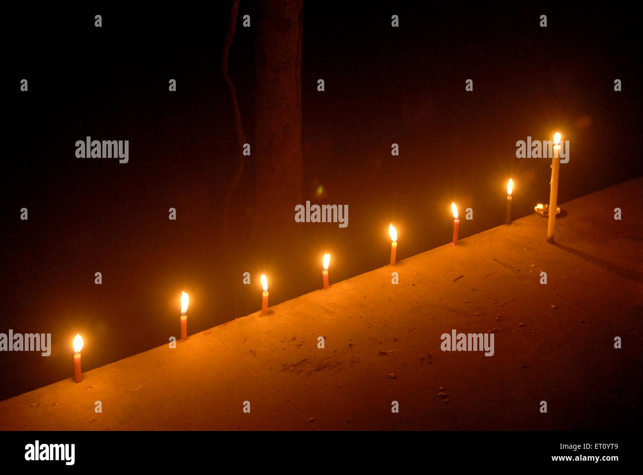 Nine candles burning for Gudi Padva Hindu New Year celebration, Masunda Lake, Thane, Maharashtra, India Stock Photo