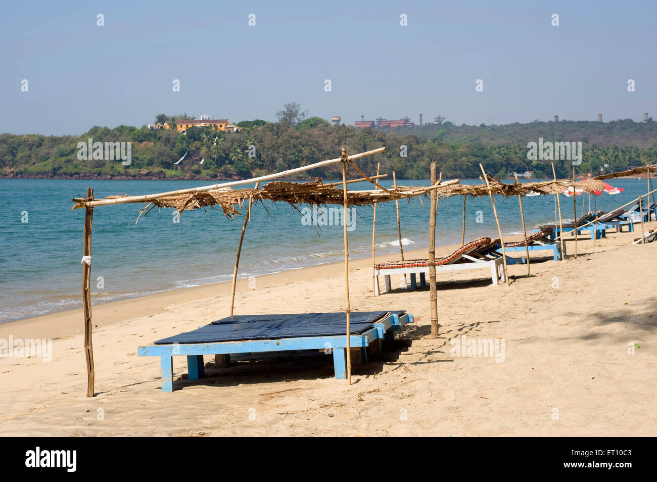Wooden beds on sand at keri beach in pernem Canacona Goa India - nmk 177250 Stock Photo