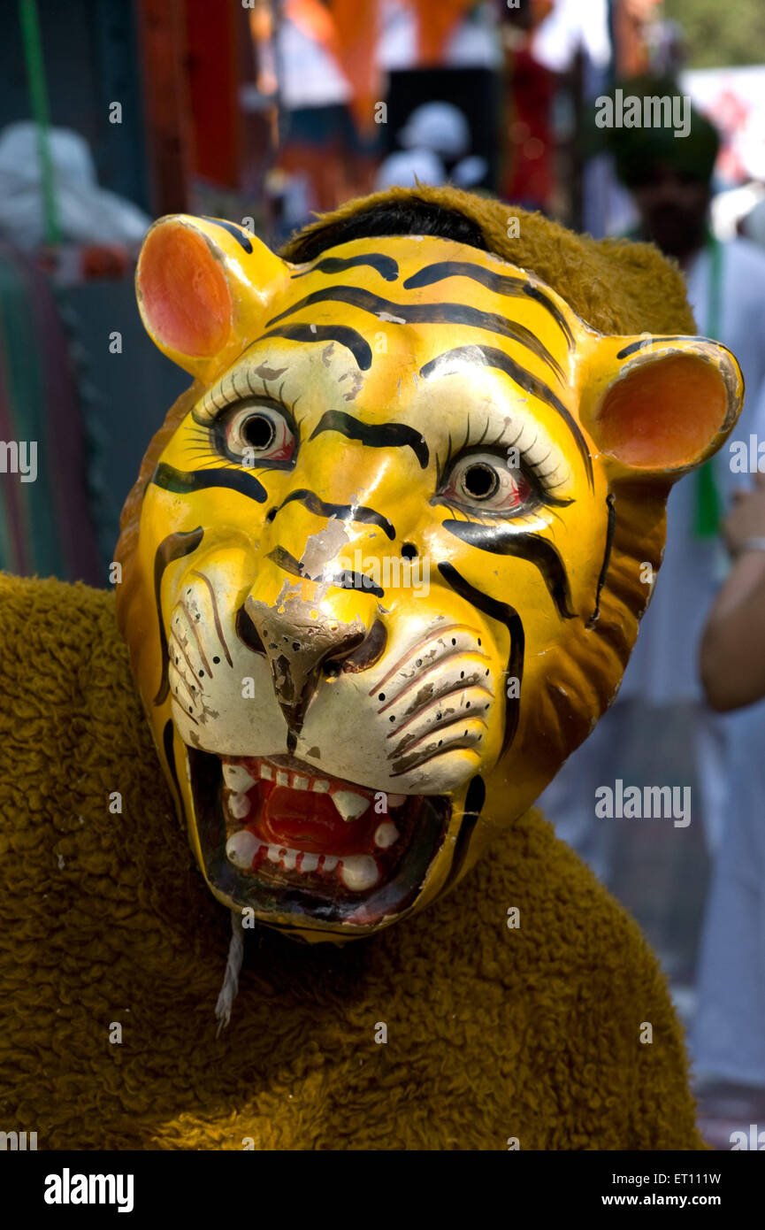 Man wearing mask of Tiger Thane Maharashtra India Asia 2011 Stock Photo