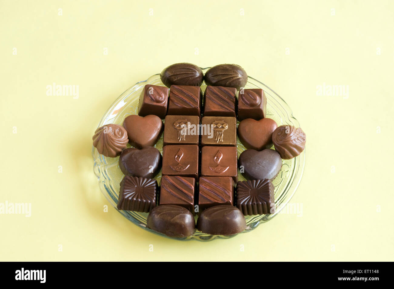 Different Chocolates on glass plate Diwali Festival Mumbai Maharashtra India Asia Stock Photo