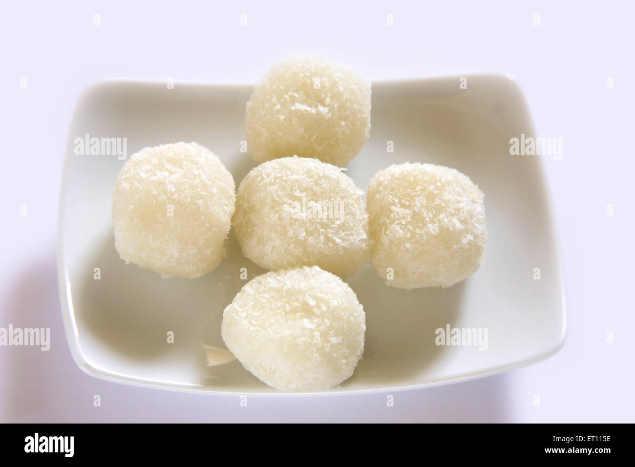 Mithai ; nariyal ka laddoos in rectangle plate on white background Stock Photo