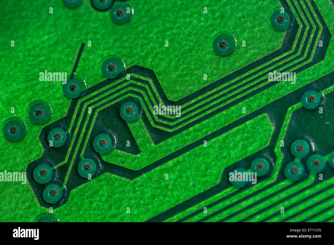 Macro-photo of printed circuit wiring for a PC motherboard. Wiring inside computer, circuit close up, detail of a circuit board, connected points. Stock Photo