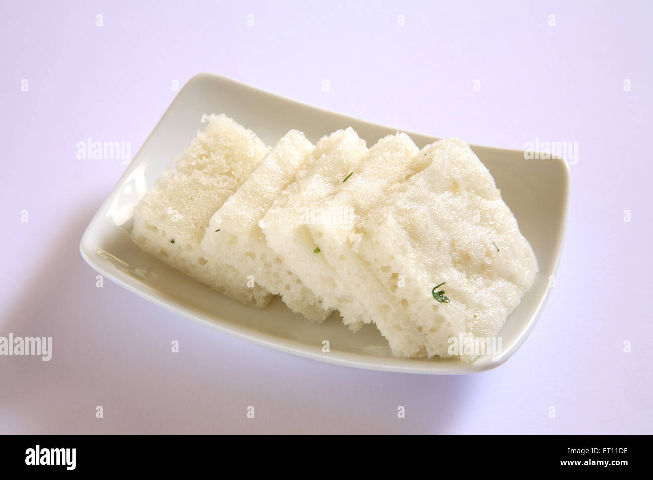 Fast food ; steamed idli in tray on white background Stock Photo