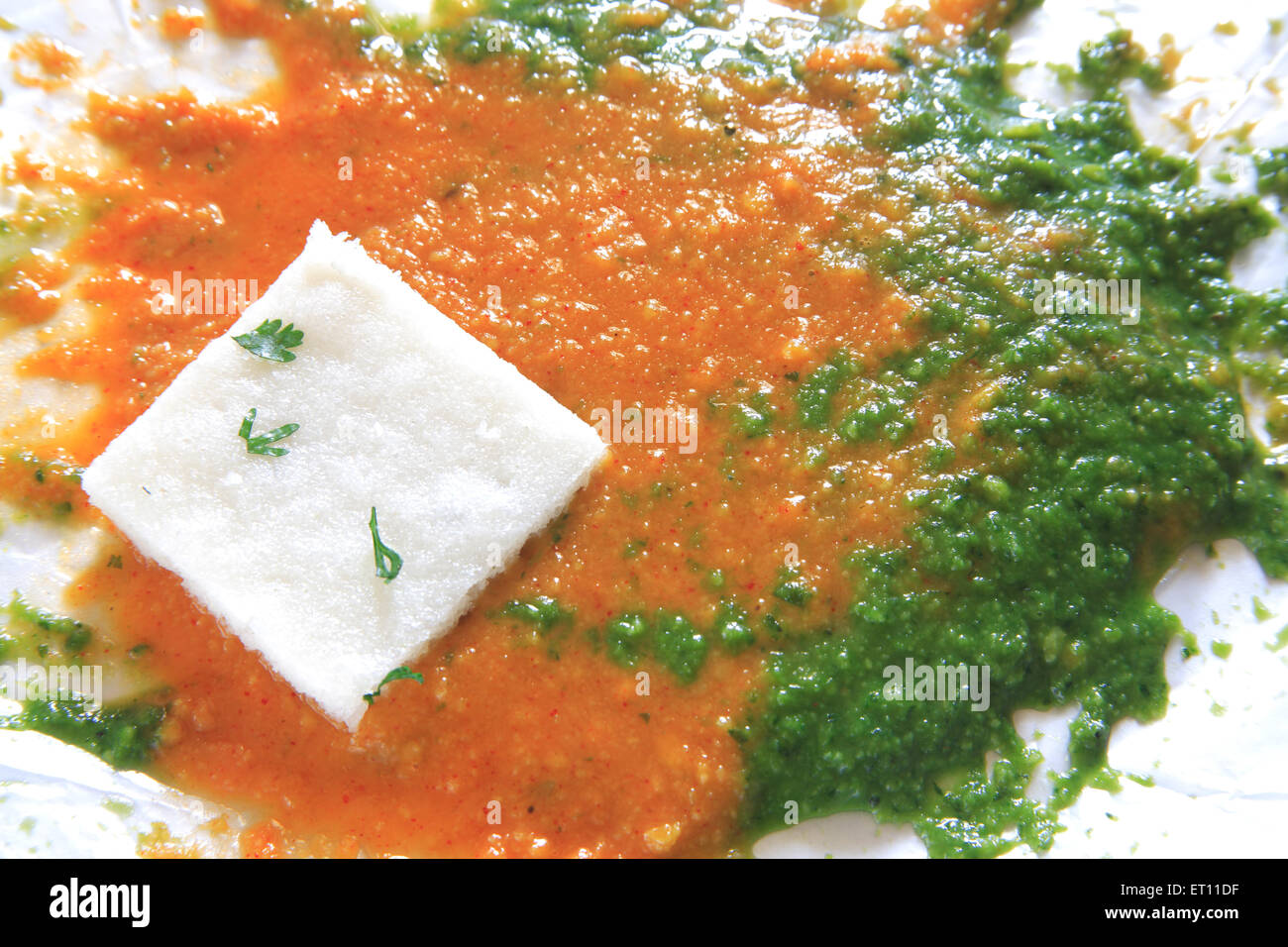 Fast food ; steamed idli with chutney and sambhar on white background Stock Photo