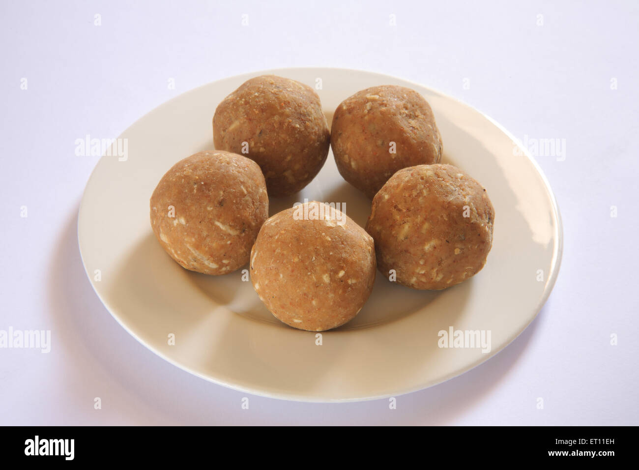 Mithai ; methi or fenugreek laddoos in tray on white background Stock Photo
