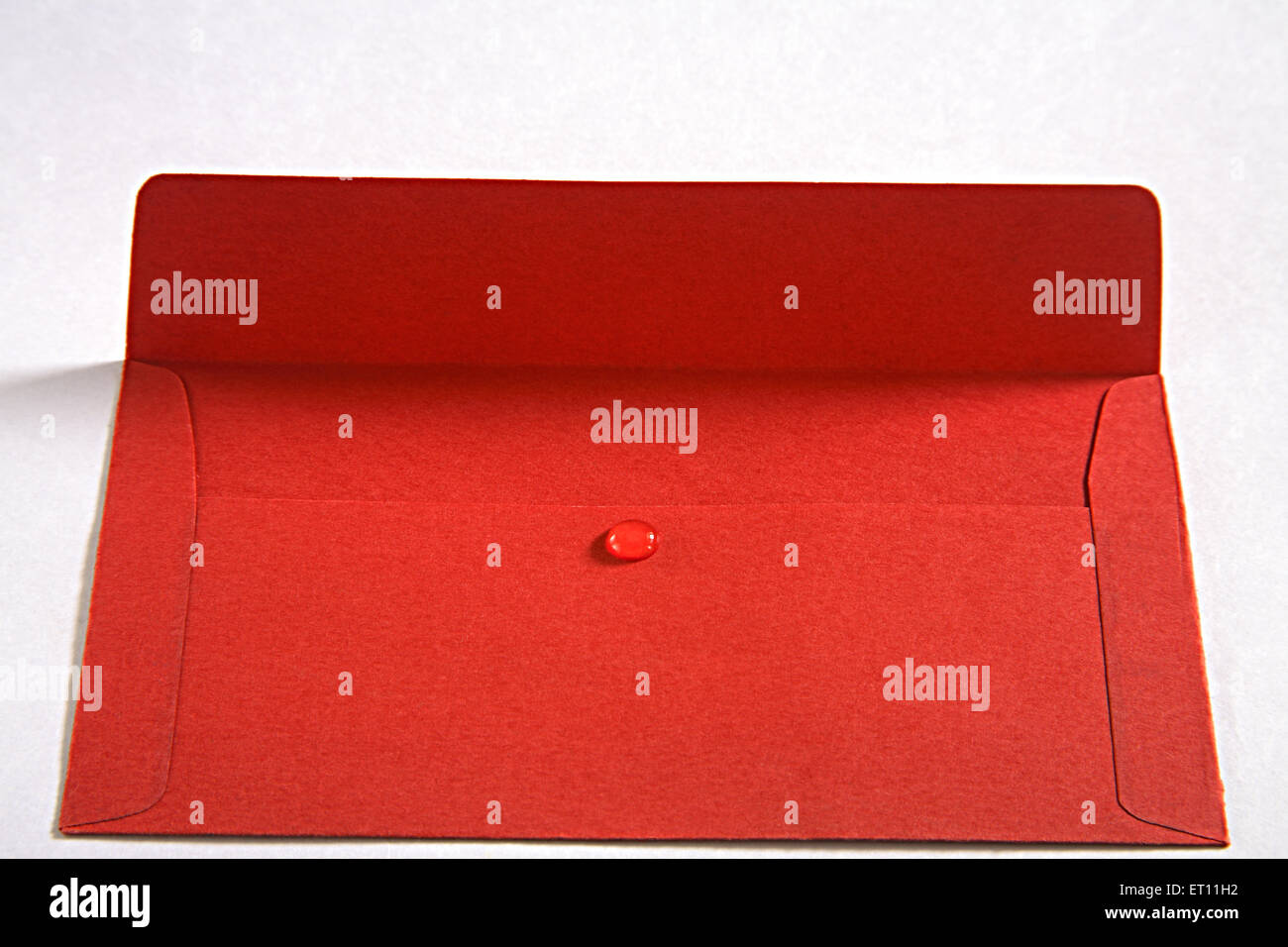 gum birdlime mastic sealant red paper envelope Stock Photo