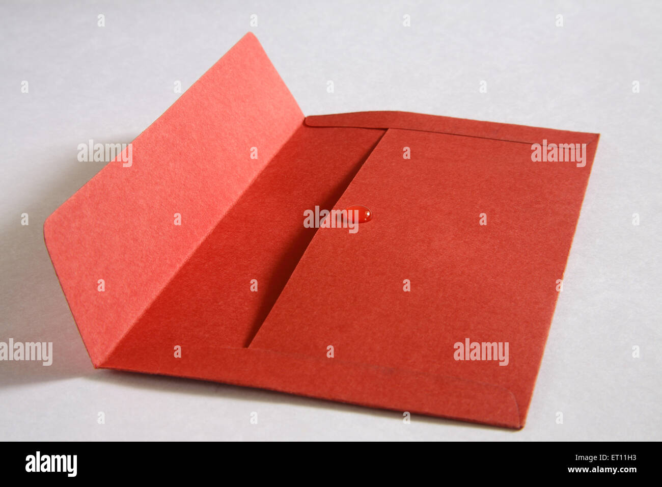 gum birdlime mastic sealant red paper envelope Stock Photo