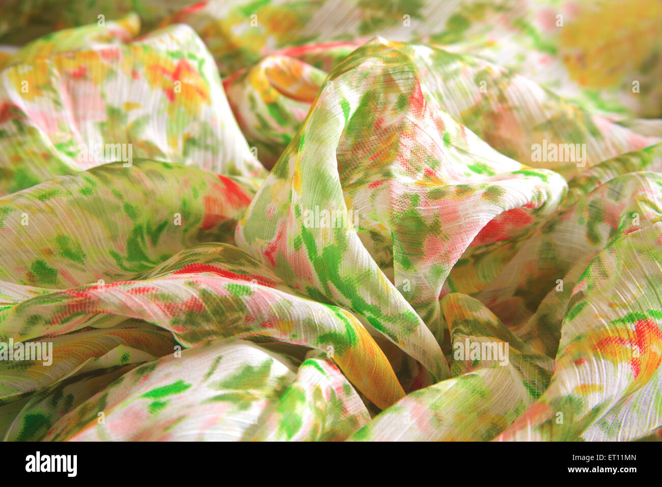 creased fabric, wrinkled textile, crumpled cloth, ruffled saree, polyester sari, Stock Photo