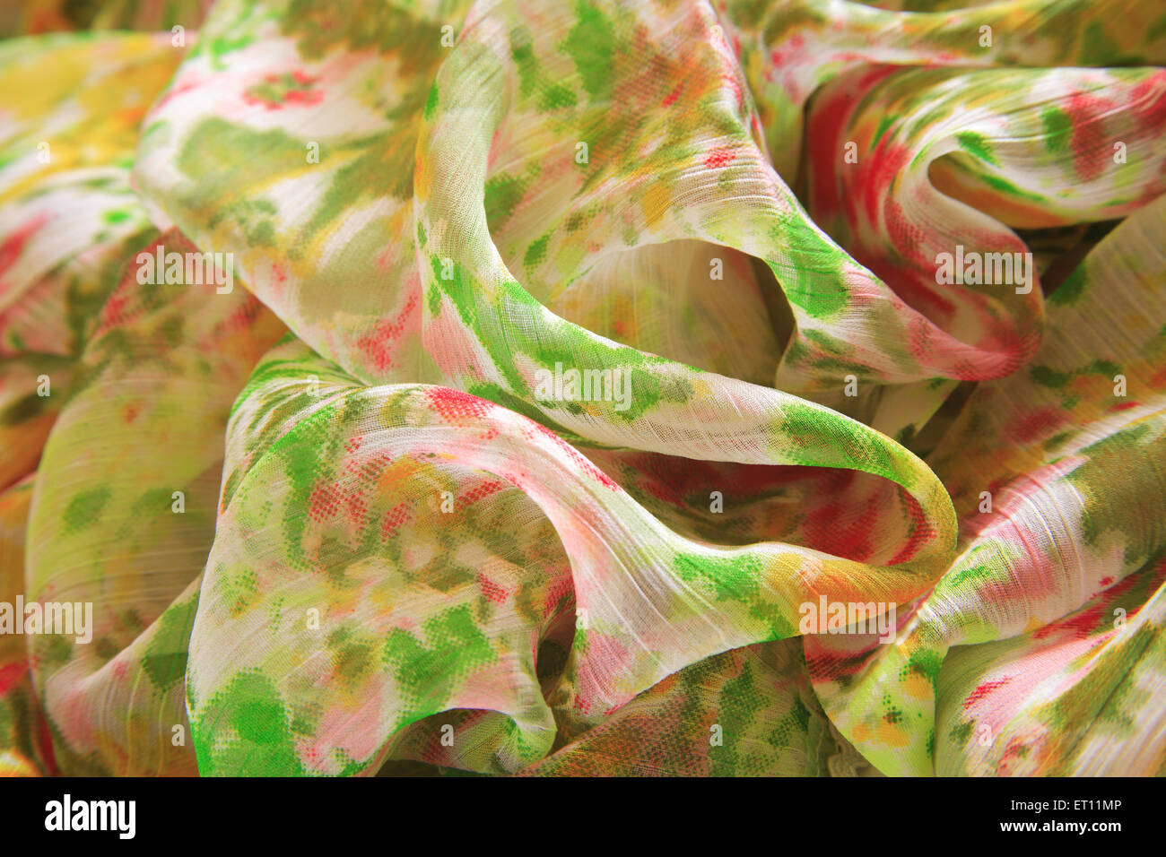 creased fabric, wrinkled textile, crumpled cloth, ruffled saree, polyester sari, Stock Photo