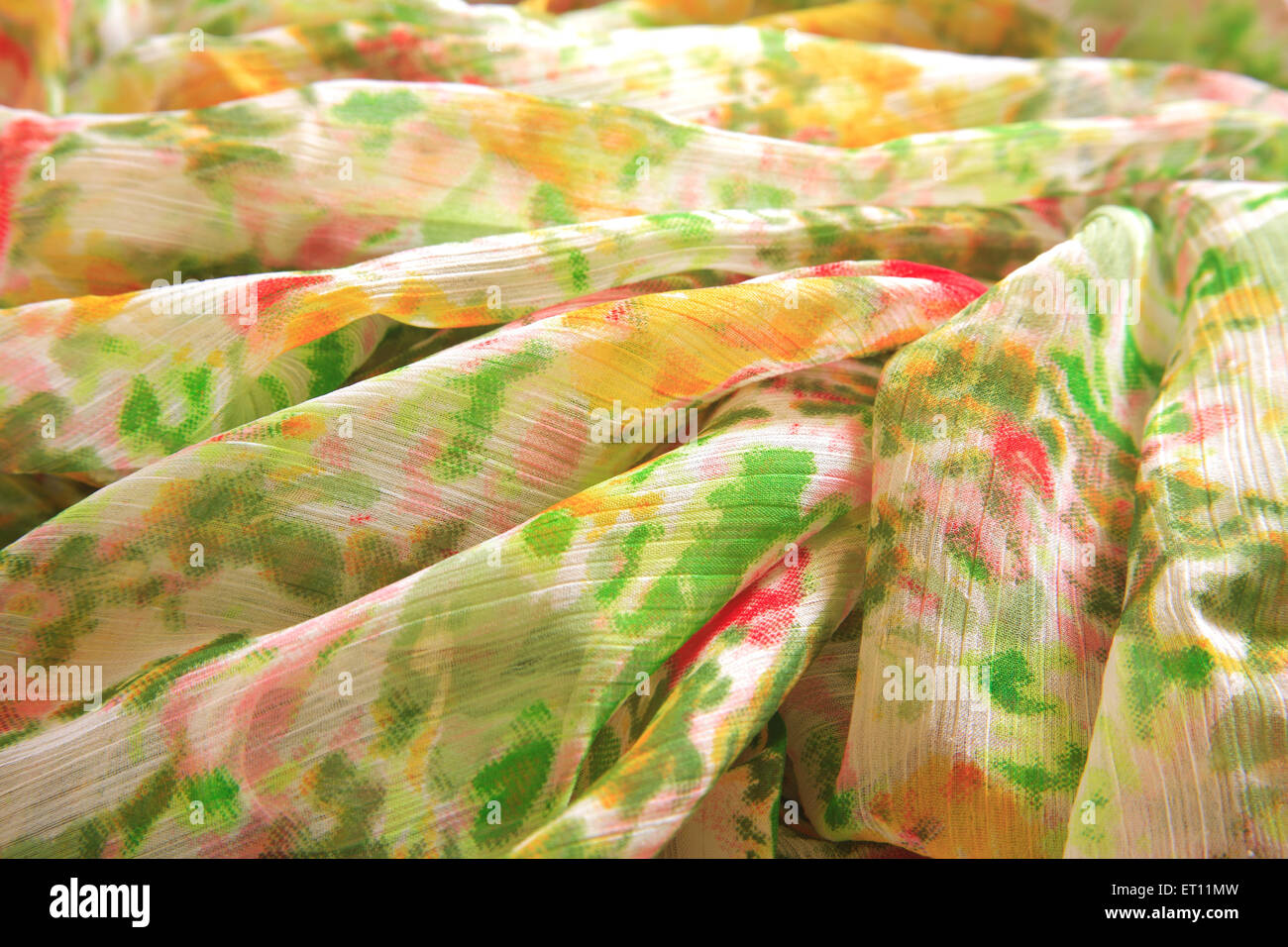 creased fabric, wrinkled textile, crumpled cloth, ruffled saree, polyester sari, Stock Photo