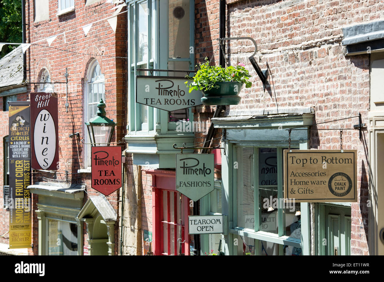 Shops sign on buildings, Steep Hill, Lincoln, Lincolnshire, England