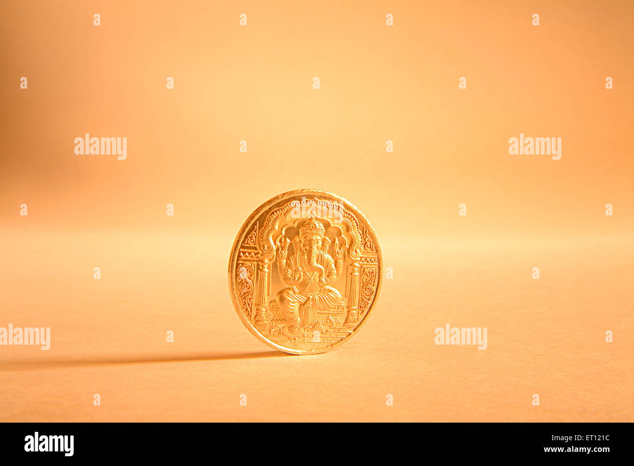 Gold coin with God Ganesh picture ; India Stock Photo