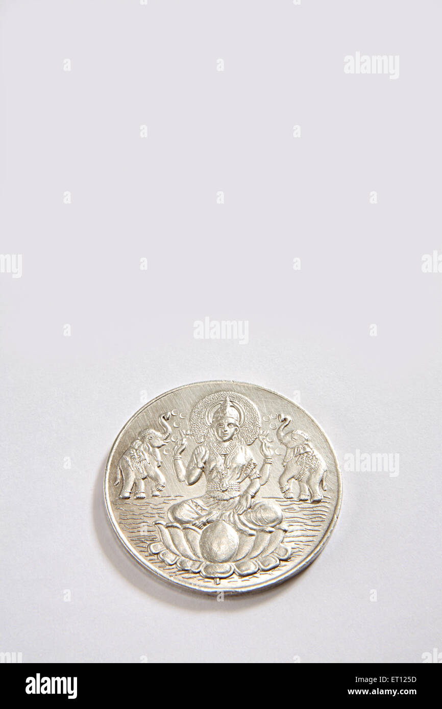 silver coin of goddess lakshmi on white background Stock Photo