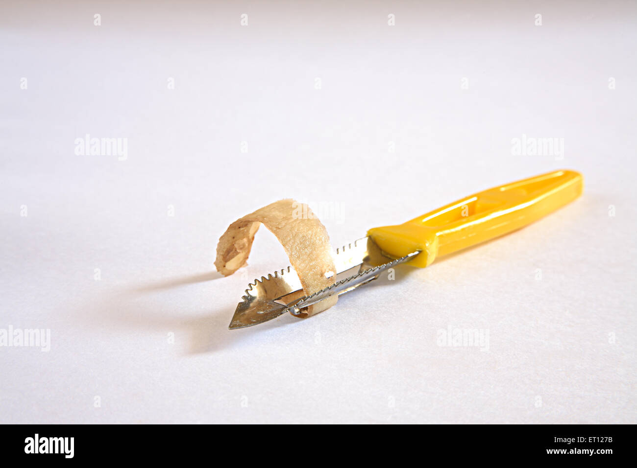 An Electric Potato Peeler On A White Surface Photograph by Jalag