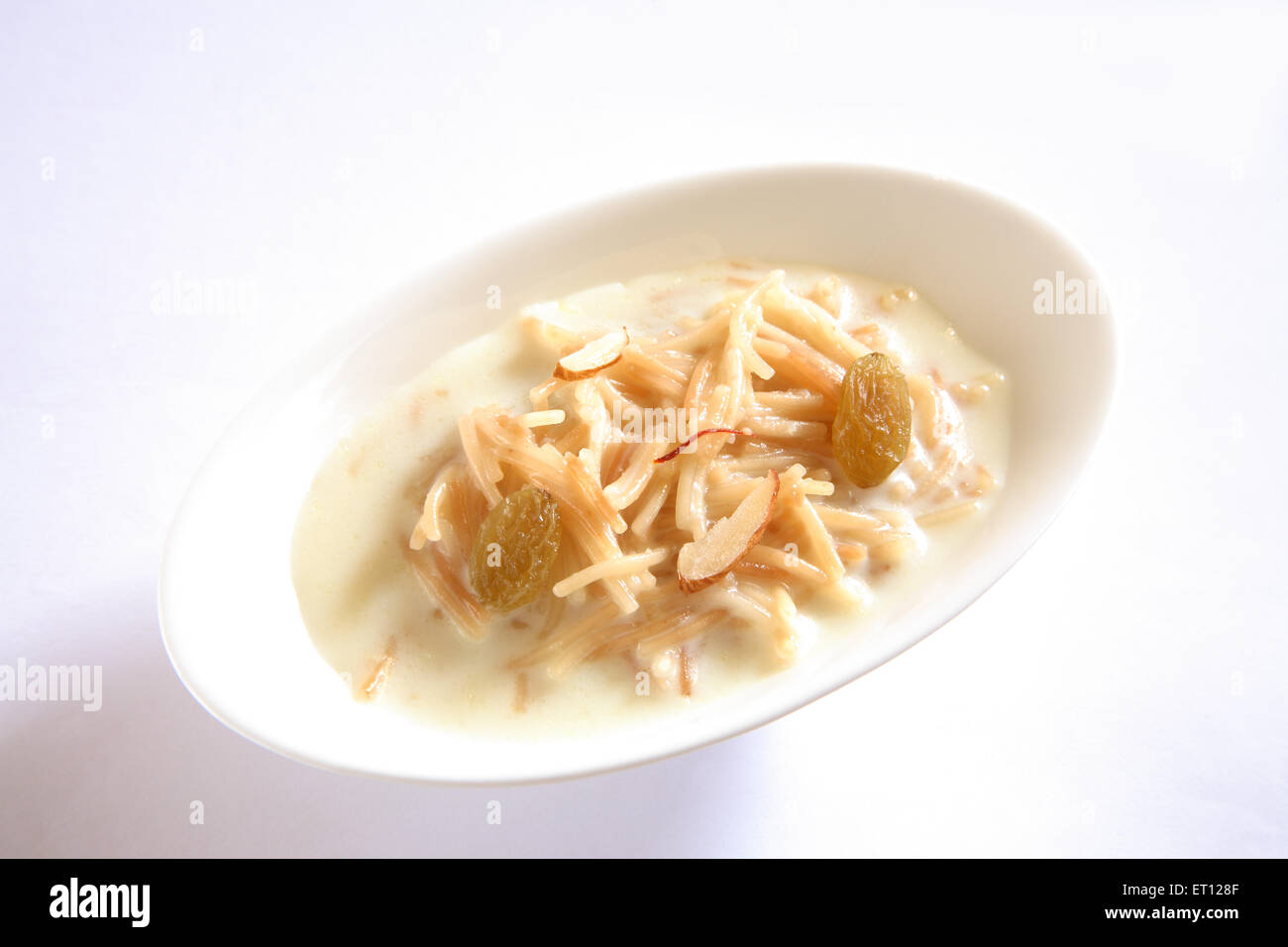 vermicelli pudding , sweet sevian , milk nuts saffron in bowl on white