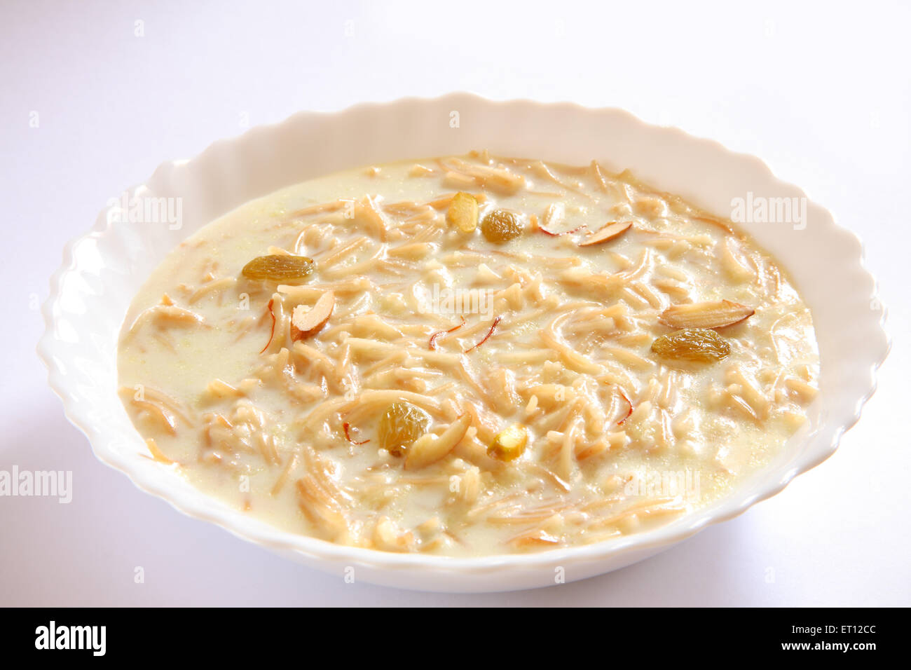 vermicelli pudding , sweet sevian , milk nuts saffron in bowl on white