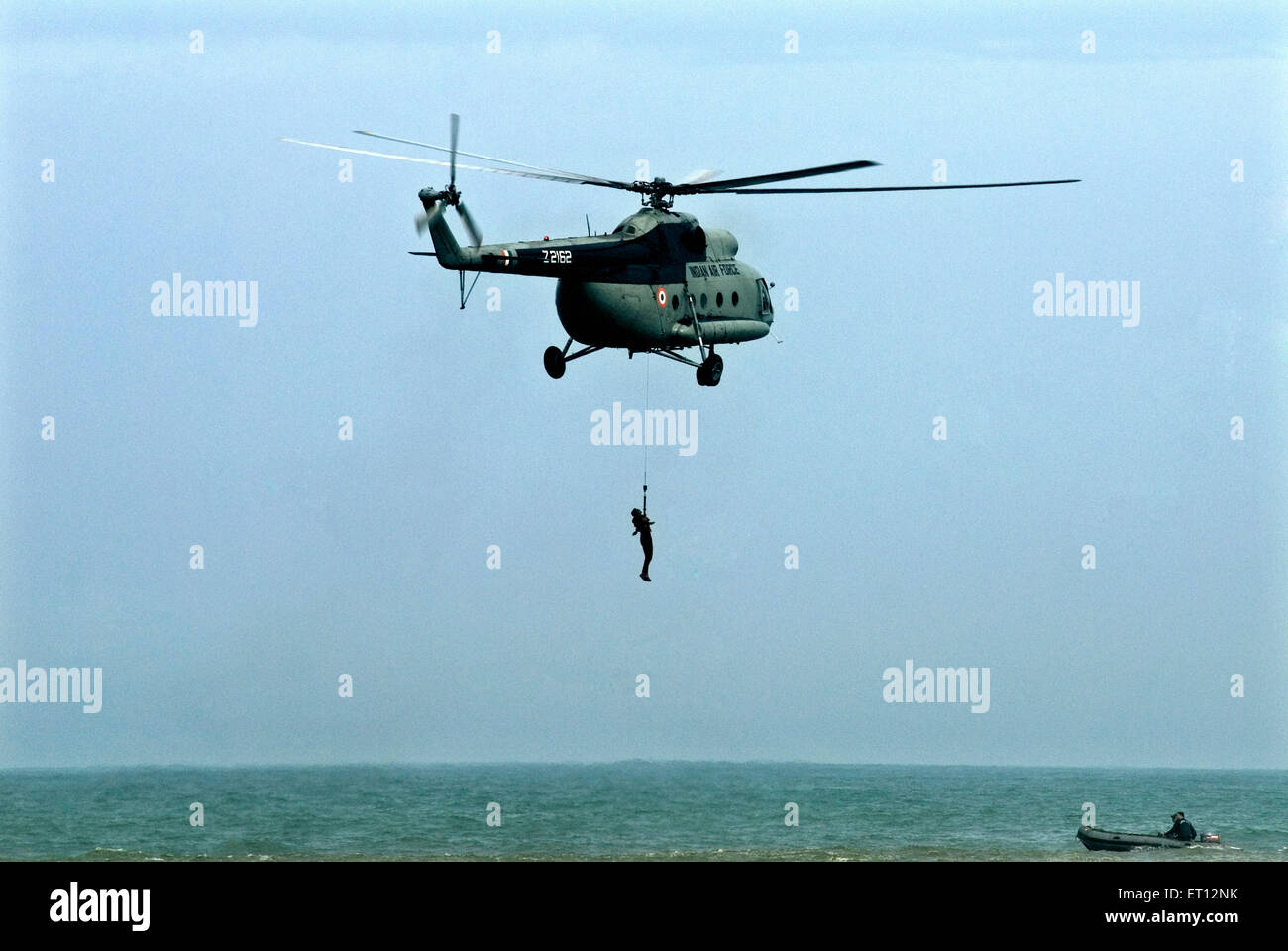 Rescue operations at sea by Air Force men using helicopter on Air Force Day Shanghumugom beach Trivandrum kerala india Stock Photo