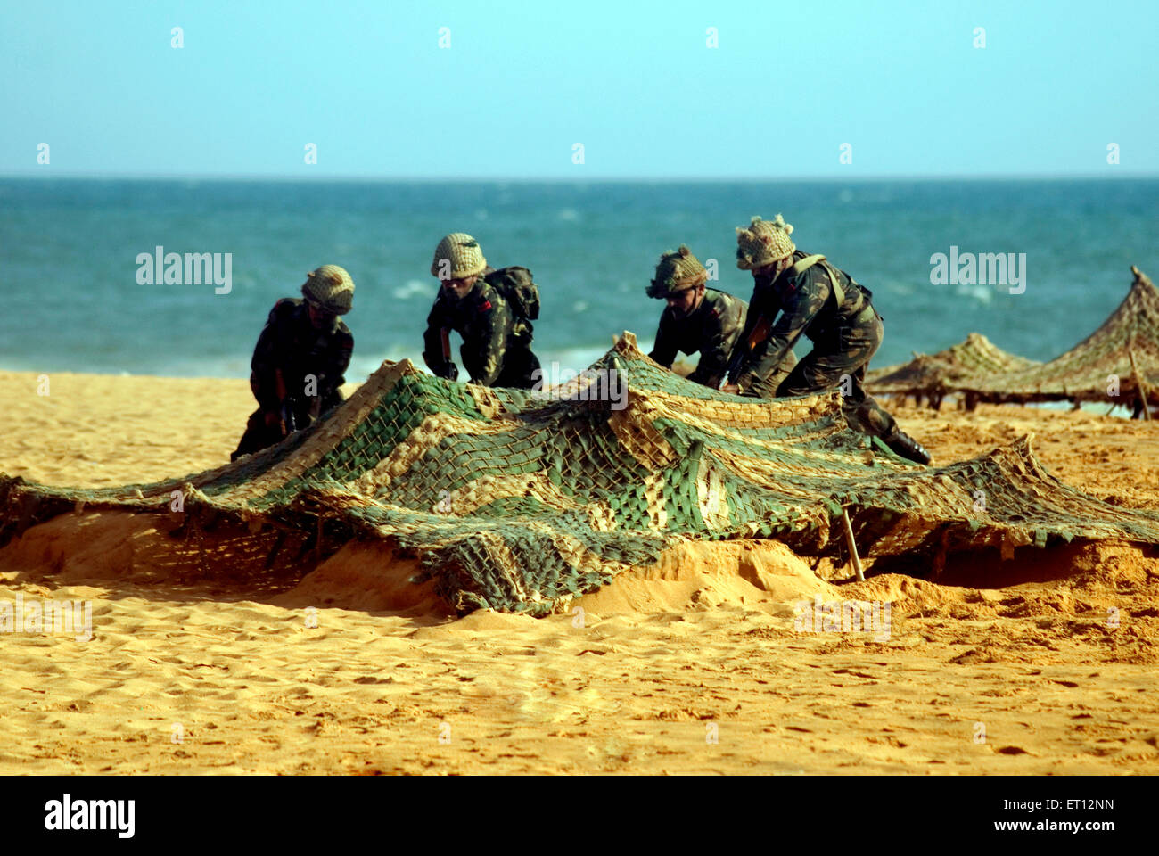 Indian Army capturing enemy bunker demonstration on Army day ;  Shankumugham Beach ; Trivandrum ; Thiruvananthapuram ; Kerala ; India Stock Photo