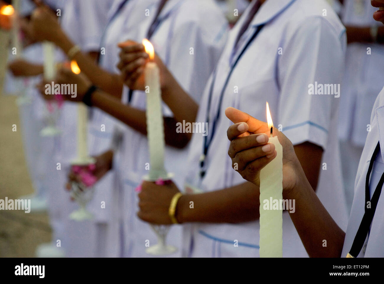 Hands protecting candles light Stock Photo Alamy