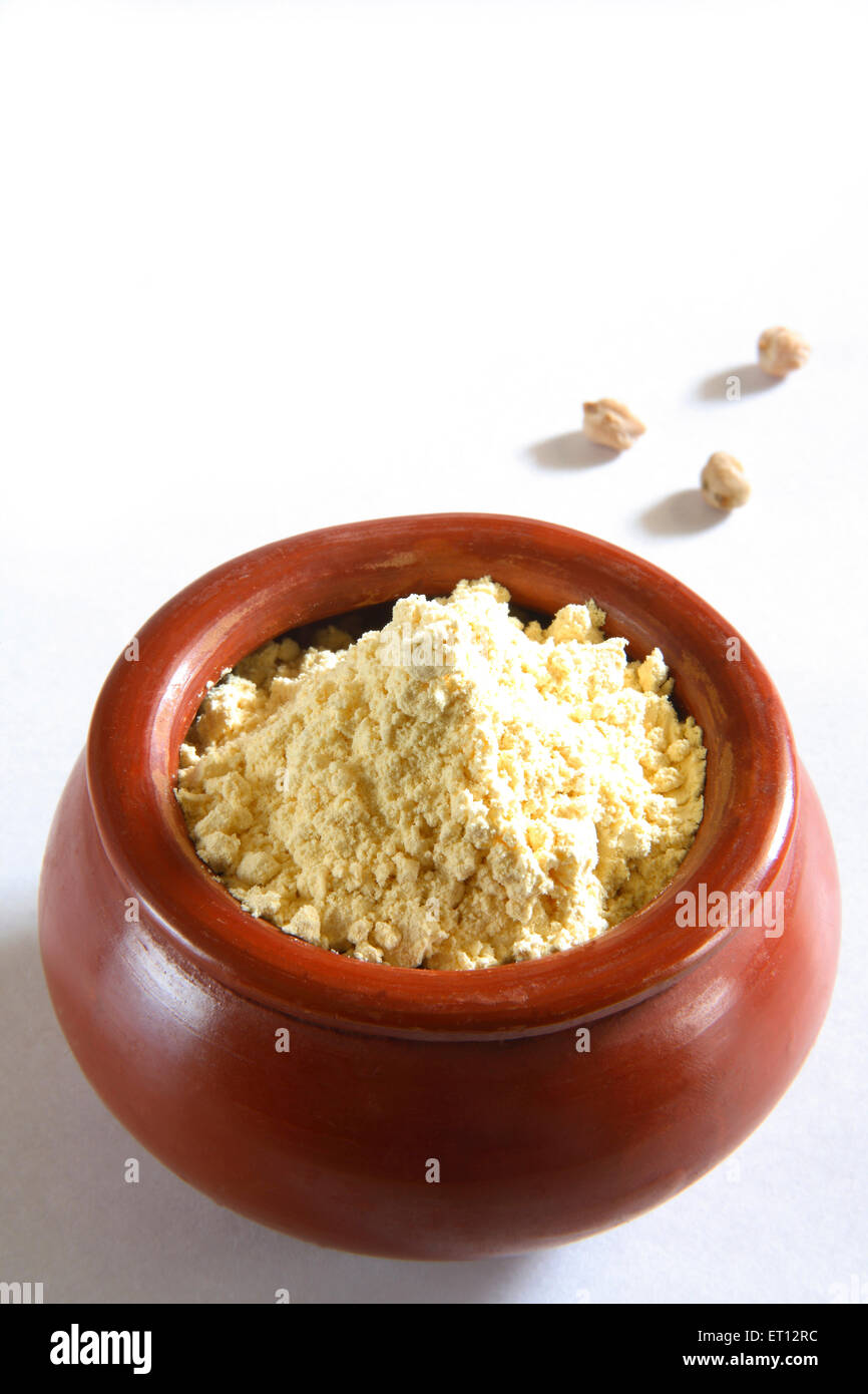 Besan gram flour in clay pot  ; India Stock Photo