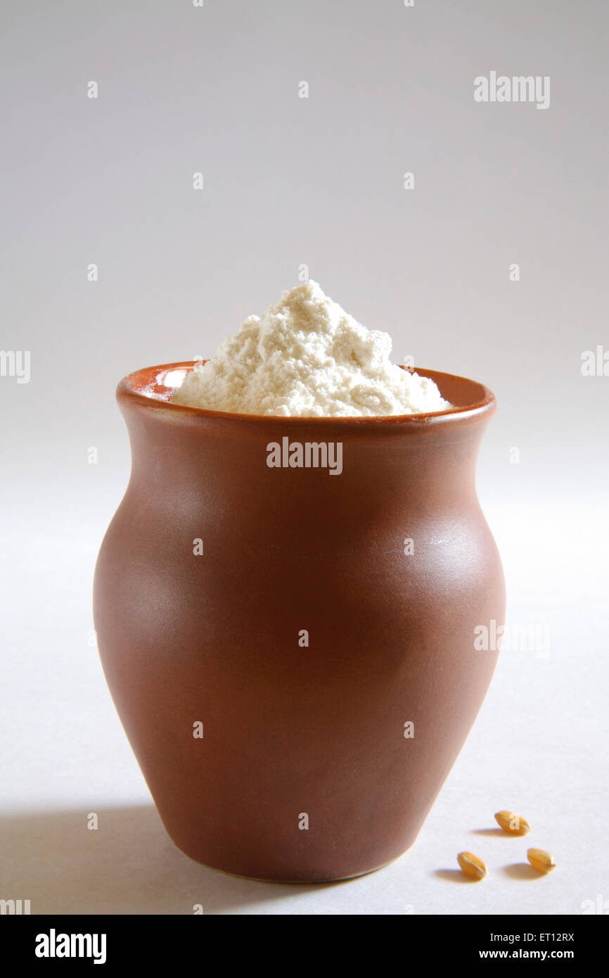 Maida ; wheat flour in clay pot ; India Stock Photo Alamy