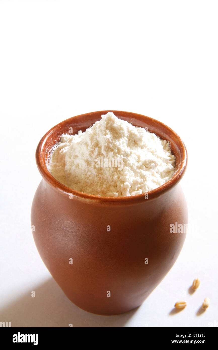 Maida ; wheat flour in clay pot  ; India Stock Photo