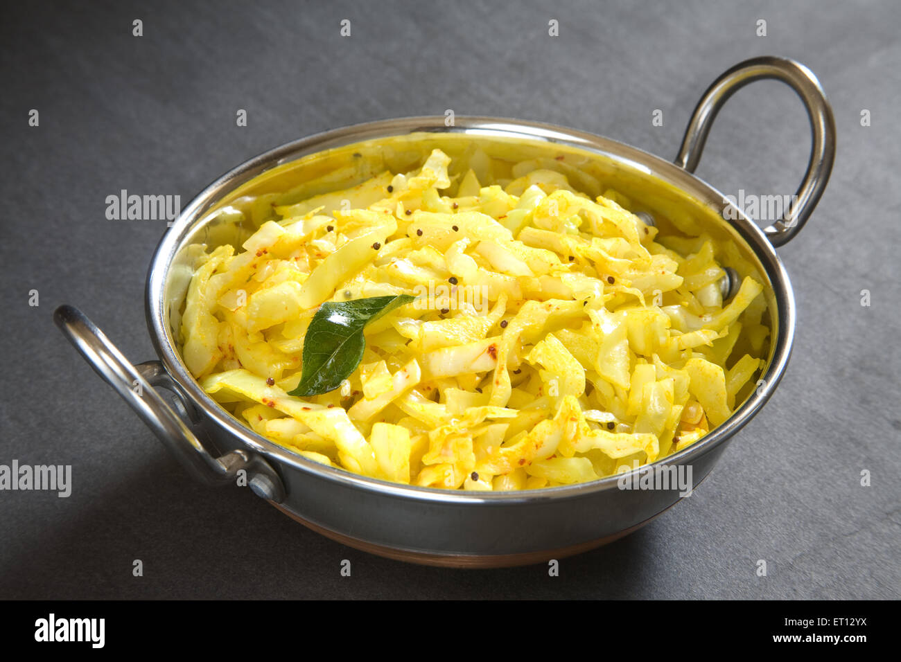 Vegetarian meal ; fry cabbage in pot on grey background 20 May 2010 Stock Photo